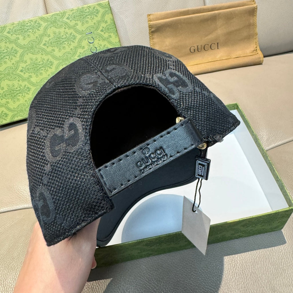 Gucci baseball cap back in dark gray with repeating GG monogram and strap detail