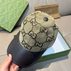 Gucci baseball cap with beige GG monogram crown and dark textured brim, top button