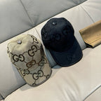 Set of two Gucci baseball caps: beige GG monogram and dark GG monogram.