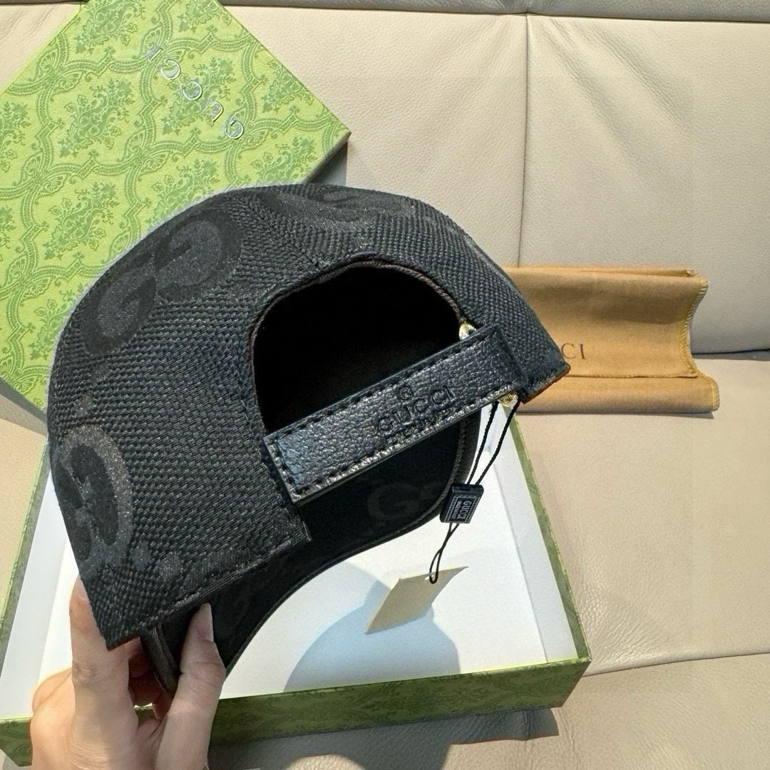 Gucci black GG-pattern baseball cap with leather side strap and metal buckle