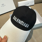 Two-tone baseball cap with black crown and white brim, large BALENCIAGA logo on front
