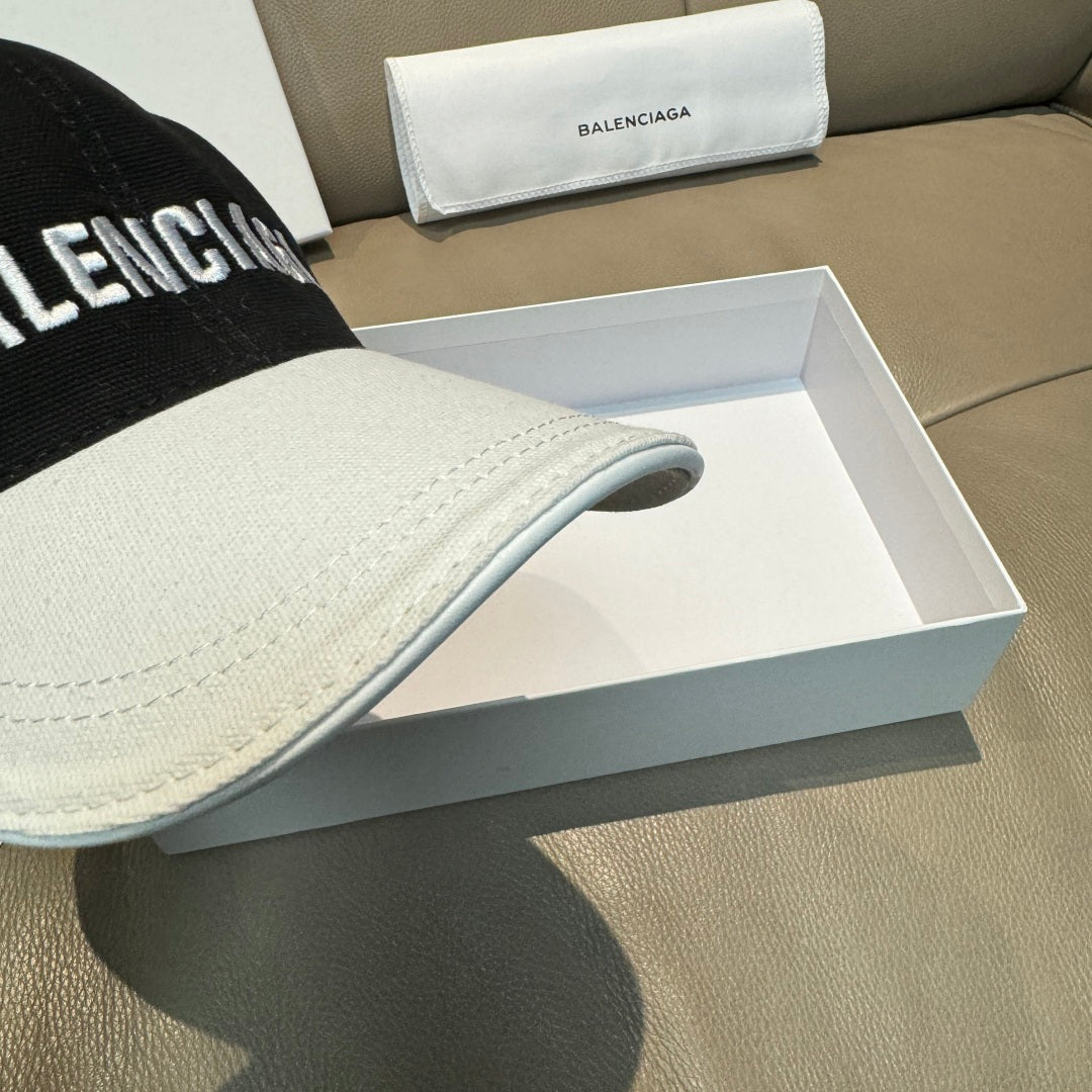 Two-tone baseball cap showing side seam and curved white brim over black crown