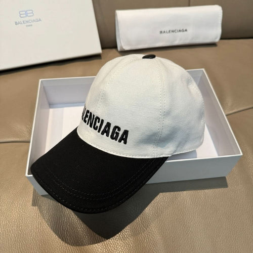 Two-tone baseball cap with BALENCIAGA lettering on light gray crown and black brim.