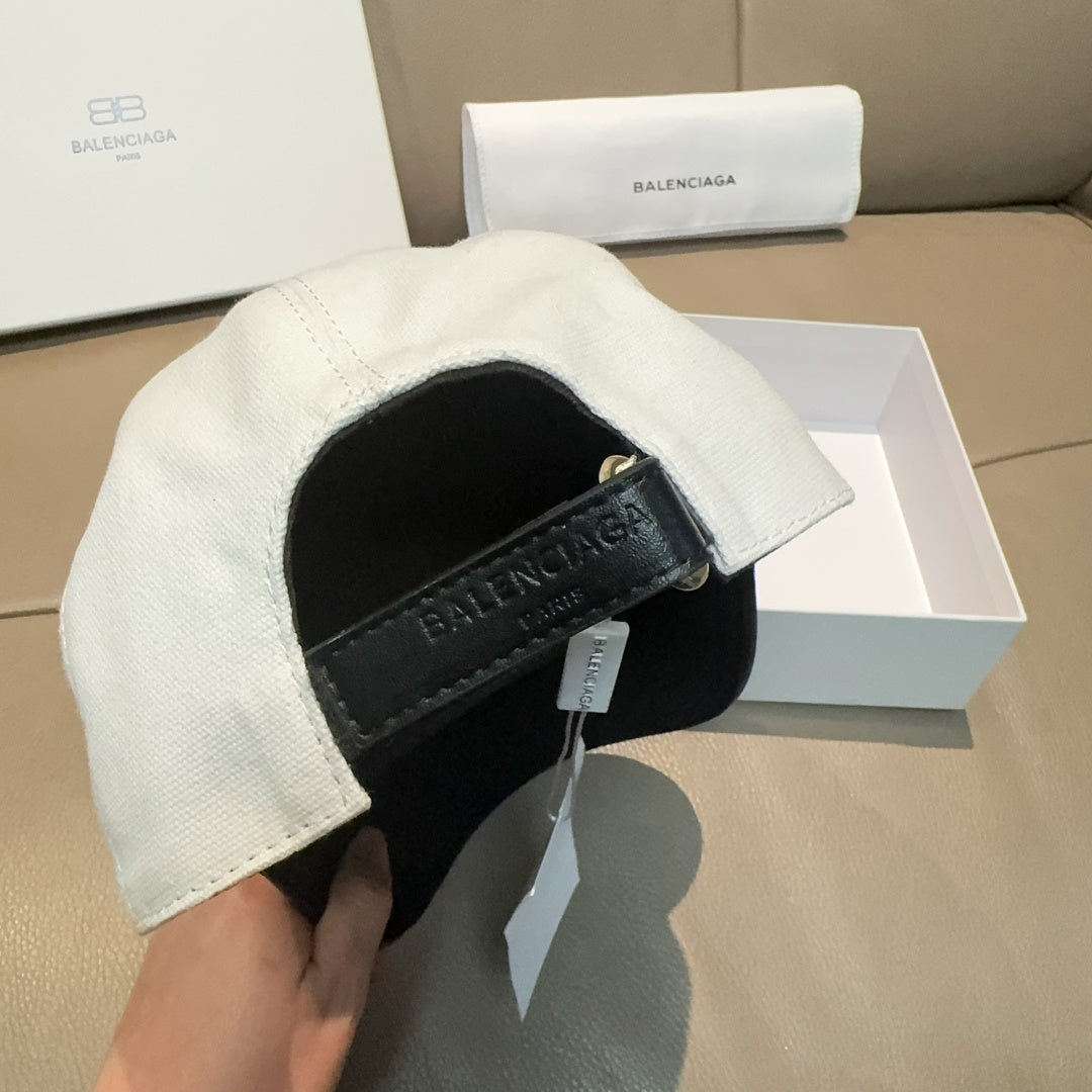 Two-tone cap with black interior band and BALENCIAGA logo, side angle