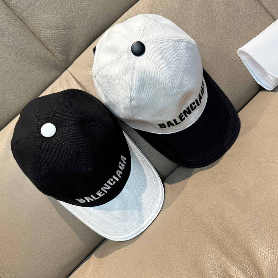 Set of two baseball caps: black cap and light cap with Balenciaga logo text