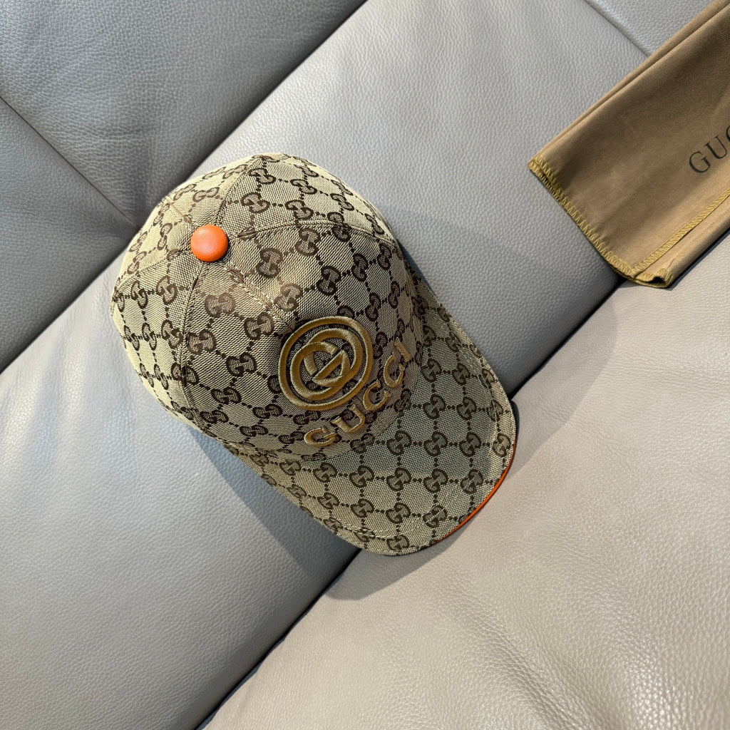 Gucci baseball cap in beige GG canvas with orange button and gold logo patch on crown