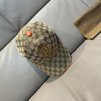 Gucci baseball cap in beige GG canvas with orange button and gold logo patch on crown