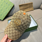 Gucci baseball cap in beige GG canvas with large gold logo emblem and orange button
