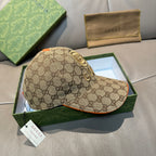Gucci baseball cap in beige GG canvas with gold logo badge and orange-edged brim trim