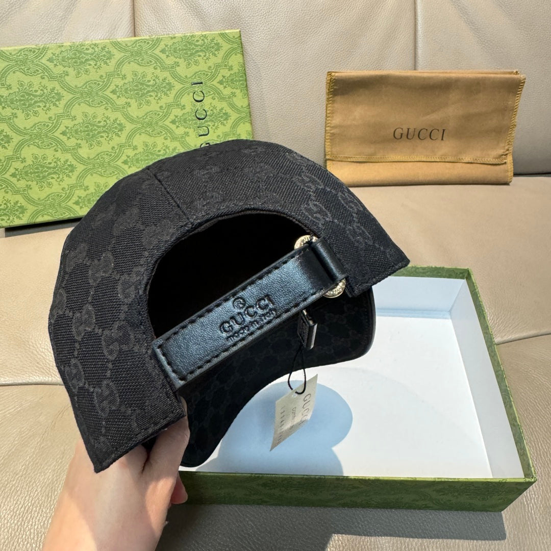 Black GG baseball cap interior with adjustable fabric strap and buckle