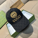 Black GG-pattern baseball cap with gold Gucci logo and curved brim