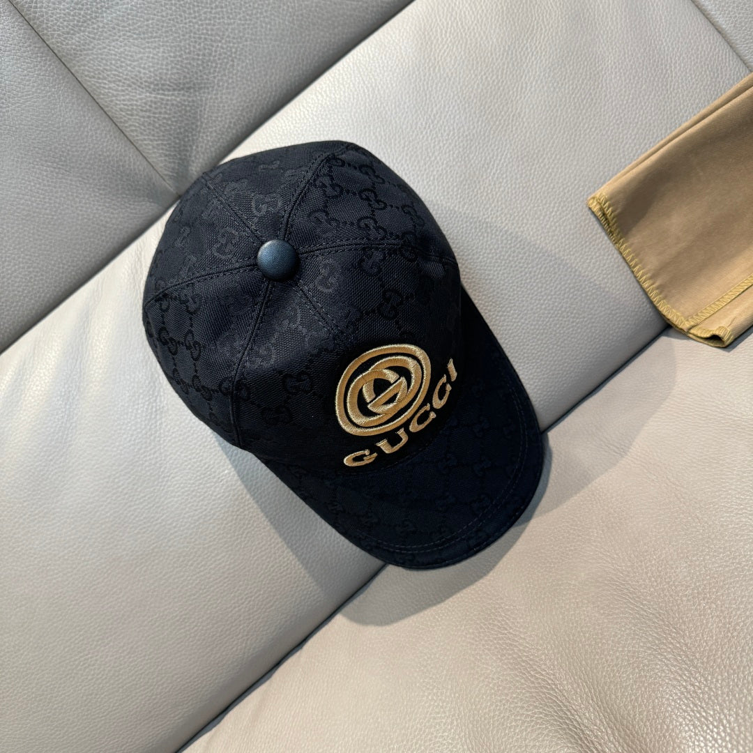 Navy GG-pattern baseball cap with front gold emblem and snap button