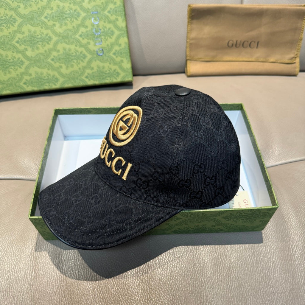 Black GG-pattern baseball cap with gold circular logo and curved brim