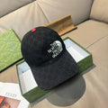 Black GG baseball cap with The North Face Gucci logo and red button on top