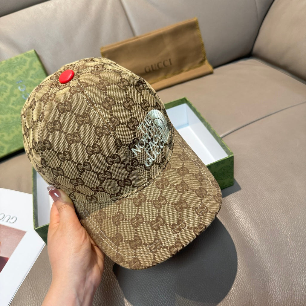 Beige GG monogram baseball cap with raised “THE NORTH FACE” patch on side