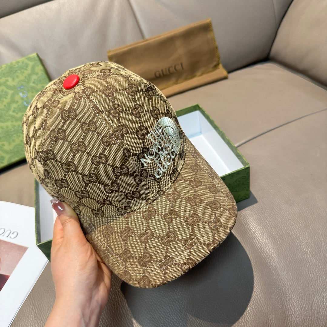 Beige GG monogram baseball cap with raised “THE NORTH FACE” patch on side