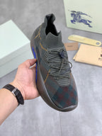 Burberry knit sneakers in dark green with multicolor plaid pattern and lace-up front