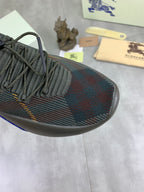 Burberry knit sneaker toe and laces in dark plaid with blue trim along side