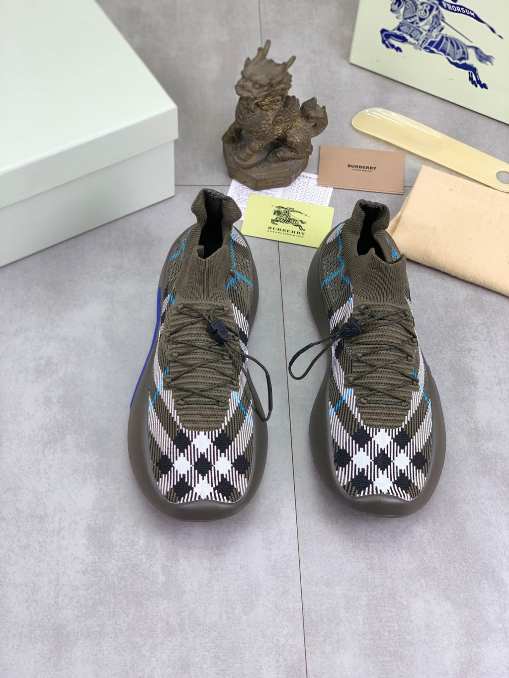 Burberry low-top knit sneakers, olive and black with check pattern and blue trim