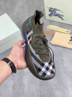 Burberry knit sneakers in dark gray/olive with black-and-white check and blue accents