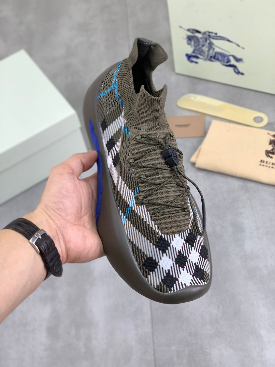 Burberry knit sneakers in dark gray/olive with black-and-white check and blue accents