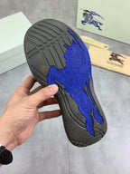 Burberry sneaker outsole tread, dark gray sole with blue traction pattern