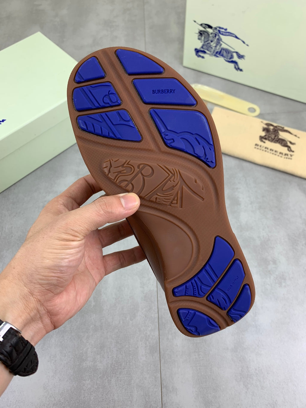 Burberry boat shoe outsole in brown and blue with molded tread and logo markings