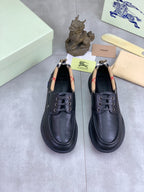 Pair of Burberry leather lace-up shoes in dark blue with check-lined collars