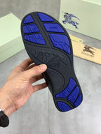 Burberry rubber outsole with blue tread pattern and traction grooves underside