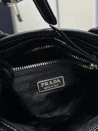Prada interior label reading PRADA Made in Italy on black leather lining