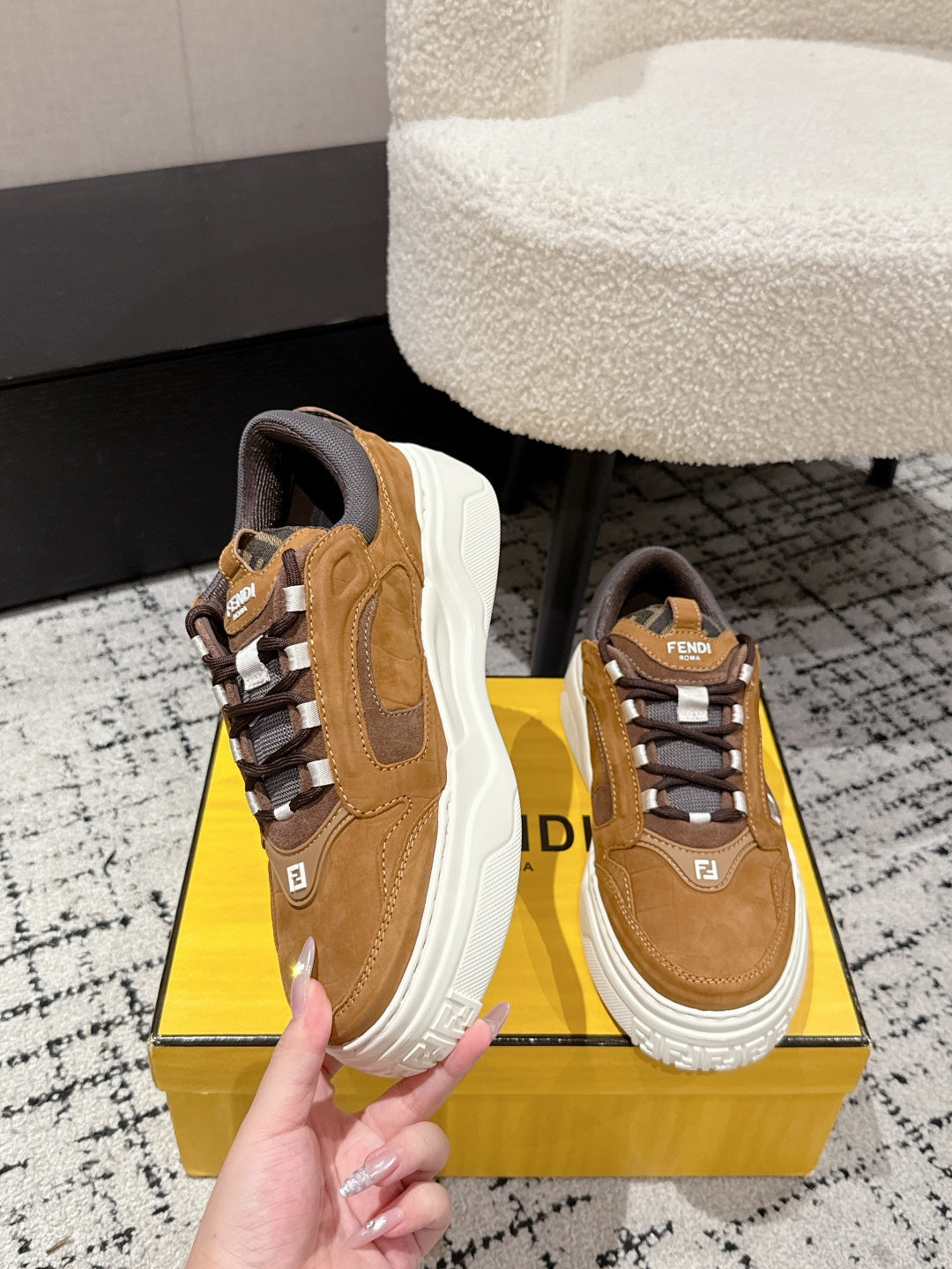 Fendi unisex sneakers with tan leather panels, gray tongue, and chunky white sole