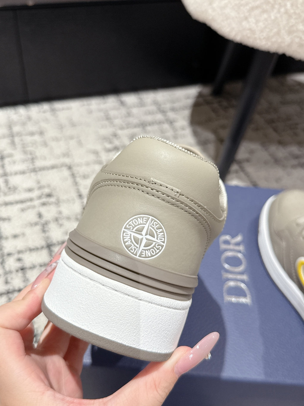 Beige Dior sneaker heel with embossed logo patch, cushioned sole