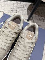 Beige Dior sneakers interior view with woven tongue label and laces