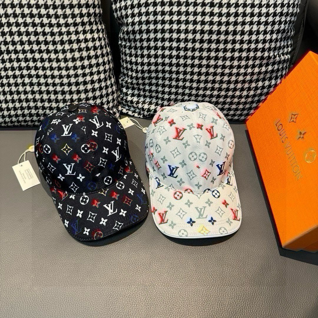 Louis Vuitton caps set: black monogram cap and light cap with colorful icons.
