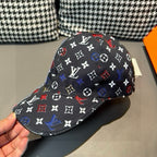Louis Vuitton cap, black monogram pattern with multicolor symbols, front close-up.