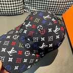 Louis Vuitton cap, black monogram pattern with multicolor symbols, side close-up.