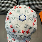 White baseball cap top view with round button detail and monogram pattern.