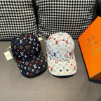 Pair of baseball caps: white and dark with multicolor monogram pattern, curved brim.