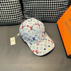 White baseball cap with multicolor monogram pattern, rear view, curved brim.