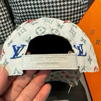 White cap interior view with leather strap and Louis Vuitton Paris marking.