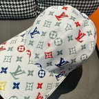 White cap with close-up multicolor monogram pattern and curved brim seam.