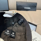 Black Chanel cap with elastic strap and front patch label