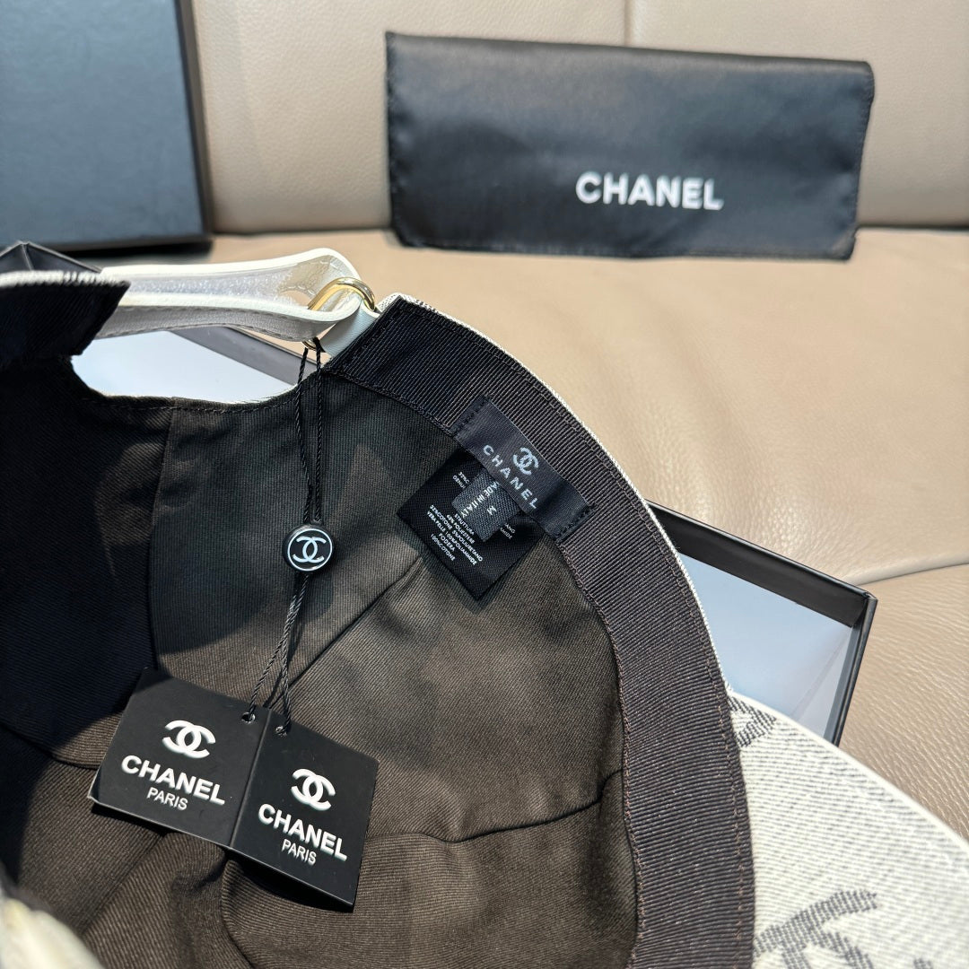 Black Chanel cap with elastic strap and front patch label
