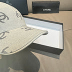 Light gray Chanel logo cap brim close-up