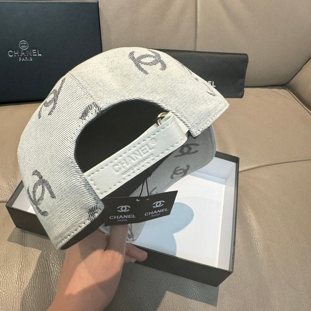 Light gray Chanel logo cap with white strap and inner band