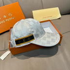 Louis Vuitton cap angled view, light gray-blue checker fabric and black monogram strap