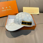 Louis Vuitton cap in light gray-blue checker pattern, adjustable black/gold logo band