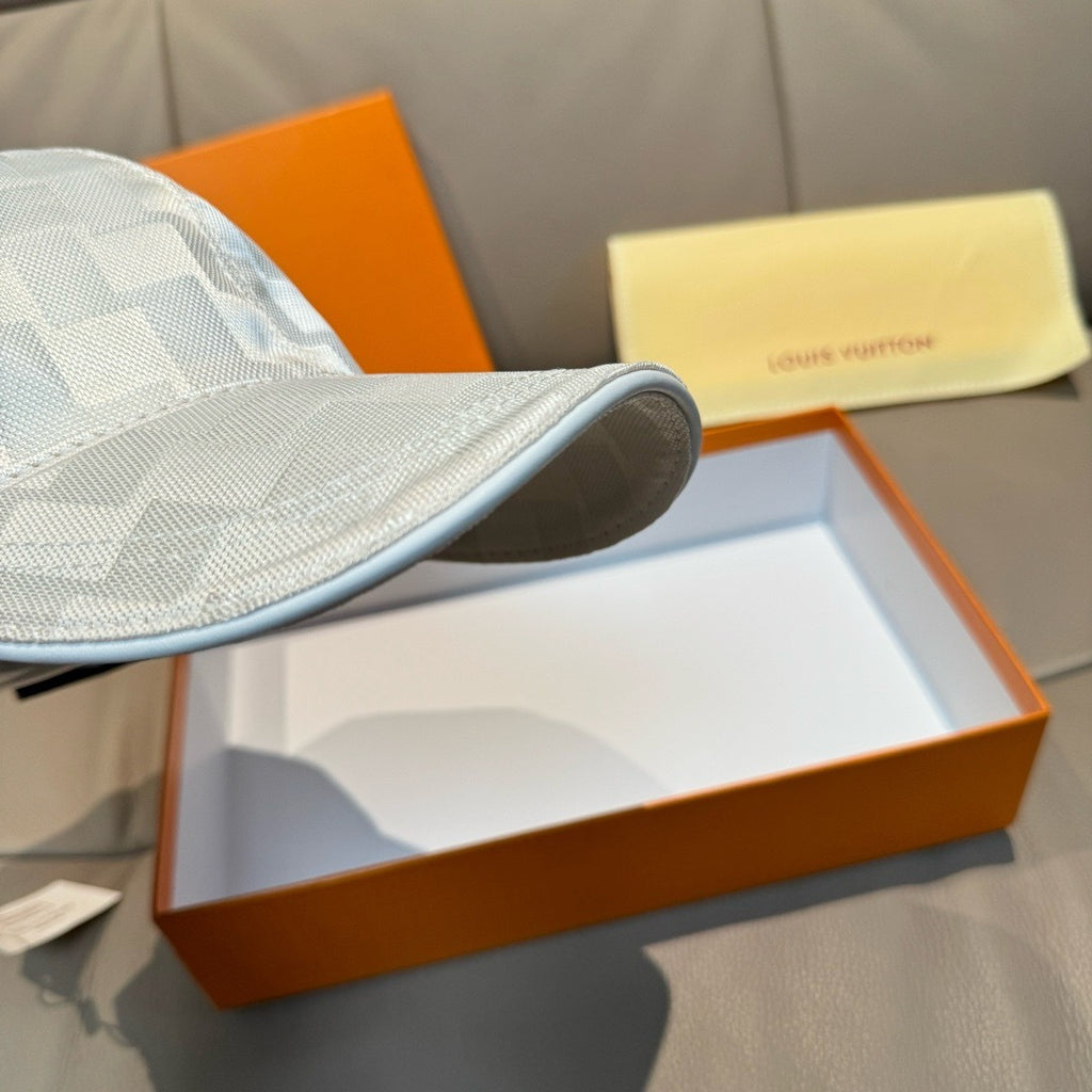 Louis Vuitton cap brim in light gray-blue checker pattern, curved edge
