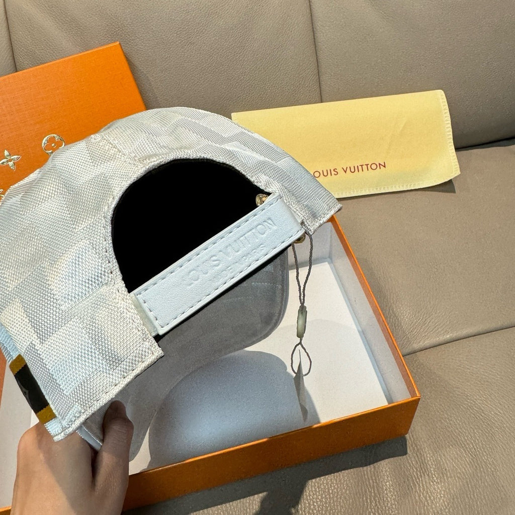 Louis Vuitton cap side view with black inner lining and light gray-blue check fabric