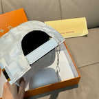 Louis Vuitton cap side view with black inner lining and light gray-blue check fabric